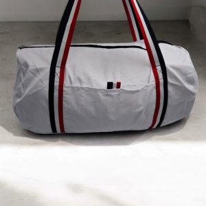 Sac polochon en tissu coton blanc détails rayés tricolores