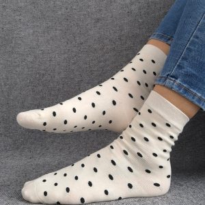 Paire de chaussettes blanches en coton à motifs pois noirs
